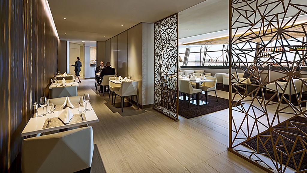 A room with tables and chairs.